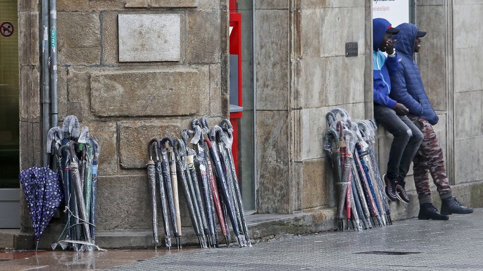 Vendedores ambulantes de paraguas